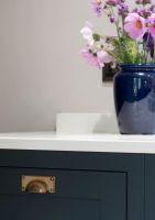 Aged Brass Rectangular Drawer Pull with Curved Handle on Drawer