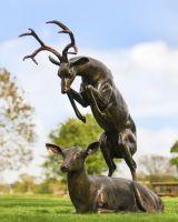 Aluminium Rutting Stag in Situ in the Garden Alongside a Resting Deer Sculpture