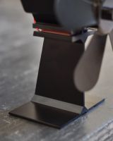 Close up of base on five blade heat powered wood stove fan