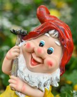 Close up of intricate face detail on colourful garden gnome ornament