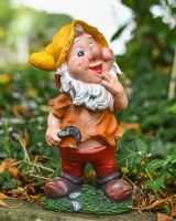 Angled view of colourful garden gnome sculpture