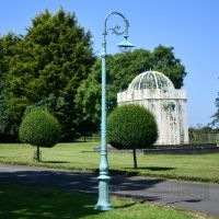 Antique Blue Cast Iron Victorian Lamp Post Installed In Garden Setting