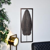 Antique Bronze Leaf Wall Art in Frame in a Modern Sitting Room