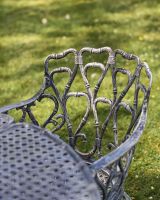 Close-Up of Ornate Backrest Design on Chair