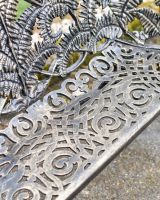 Close-Up of Seat on Antique Gold Palm Leaf Garden Bench