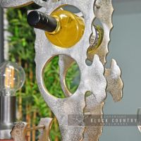 Wine Bottle Being Held in the Wine Rack