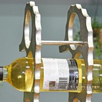 Wine Bottle Being Held in the Wine Rack