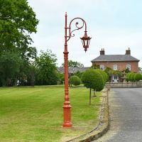 Antique Red Ornate Lamp Post in driveway of period property