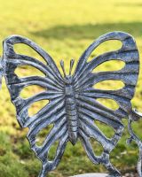 Close Up of Antique Silver Butterfly Design Two Seater Bench Bench Back