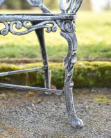 Close Up Of Antique Silver Butterfly Design Two Seater Bench Leg