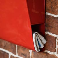 Close-up of Newspaper Holder on Apple Orchard” Red Berkley Hill Post Box With Lock