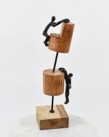 Angled view of cast aluminium and mango wood home decor ornament