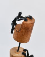 Close up of black cast aluminium figure on home decor sculpture