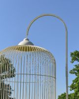 Close up of intricate loop hook detail on ornate ivory birdcage gazebo 