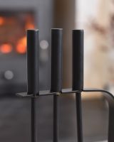 Close up of black handles on fireside companion set