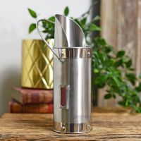 Match holder finished in brushed steel with carry handle