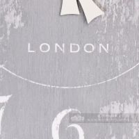Close up of printed text "London" on wall clock