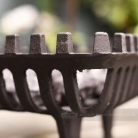 close up of cast iron detailing on fire basket