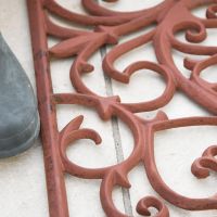 Close-up of the Ornate Scroll Pattern on the Doormat