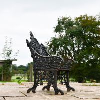 Side view of Aged Black Cast Iron Gothic Bench