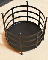 Close-Up of Empty Black "Basket" Log Holder