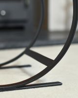 Close Up Of Black Blacksmith Curved Log Rack Structure
