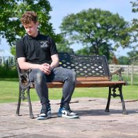 Aged Black Cast Iron & Wood Garden Bench with Male for Scale