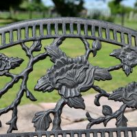 Close up of Aged Black Cast Iron Rose Motif on Backrest