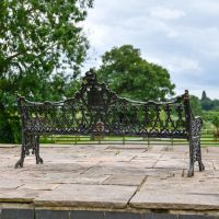 Rear view of Aged Black Cast Iron Gothic Three Seater Garden Bench
