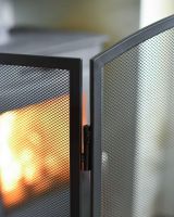Close-Up of Metal Frame on Black Central Arched Three Fold Fire Guard with Mesh
