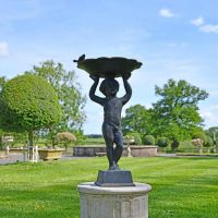 Black Cherub Bird Bath in Situ in the Garden