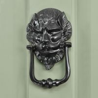 Black Lion Door Knocker in Situ on a Green Door