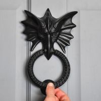 Scale Shot of Black Dragon Head Door Knocker