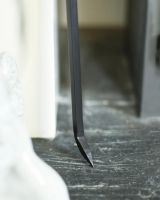 Close Up of Black Hooked Fireside Poker Tip