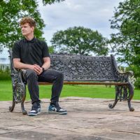 Aged Black Cast Iron Leaf Scroll Bench with Male for Scale