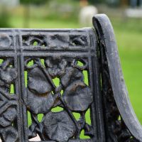 Close up of Aged Black Cast Iron Leaf Bench