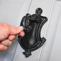 Scale Shot of Black Oxford Cast Iron Door Knocker