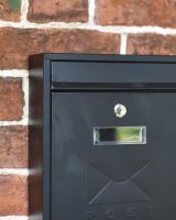 Close-Up of Black Rectangular Steel "POST" Wall Mounted Post Box with Lock