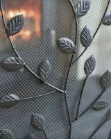 Close Up Of Black Rectangular Three Fold Fire Guard with Leaf Pattern Leaf Detailing