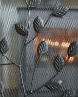 Close Up Of Black Rectangular Three Fold Fire Guard with Leaf Pattern Detailing