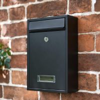 Slim Black Lockable Wall Mounted Post Box in Situ on a Brick Wall