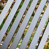 Close-up of the Metal Slates on the Seat of the Bench