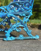 Close up of side detailing on intricate outdoor bench