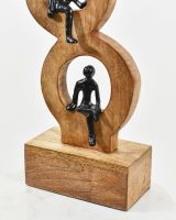 Close up of bottom figure on aluminium and mango wood home sculpture