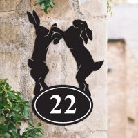 Boxing Hares Iron House Number Sign in Situ on a House