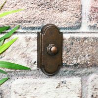 rectangle shaped burnished copper door bell push with arched top
