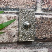 Chrome ornate front door bell