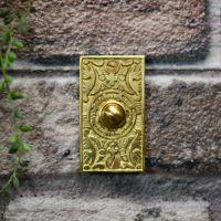 Rectangle door bell buzzer on brick wall