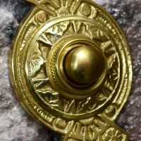 close up of push button on door bell