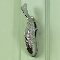 Bright Chrome Fish Door Knocker On Green Door